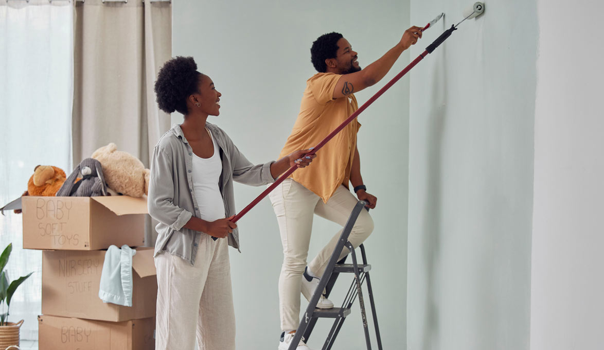 couple-painting-nursery-in-new-home
