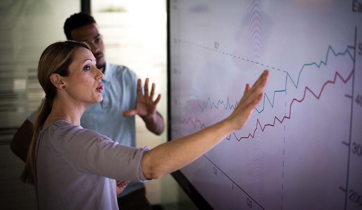 man and women discussing economic growth