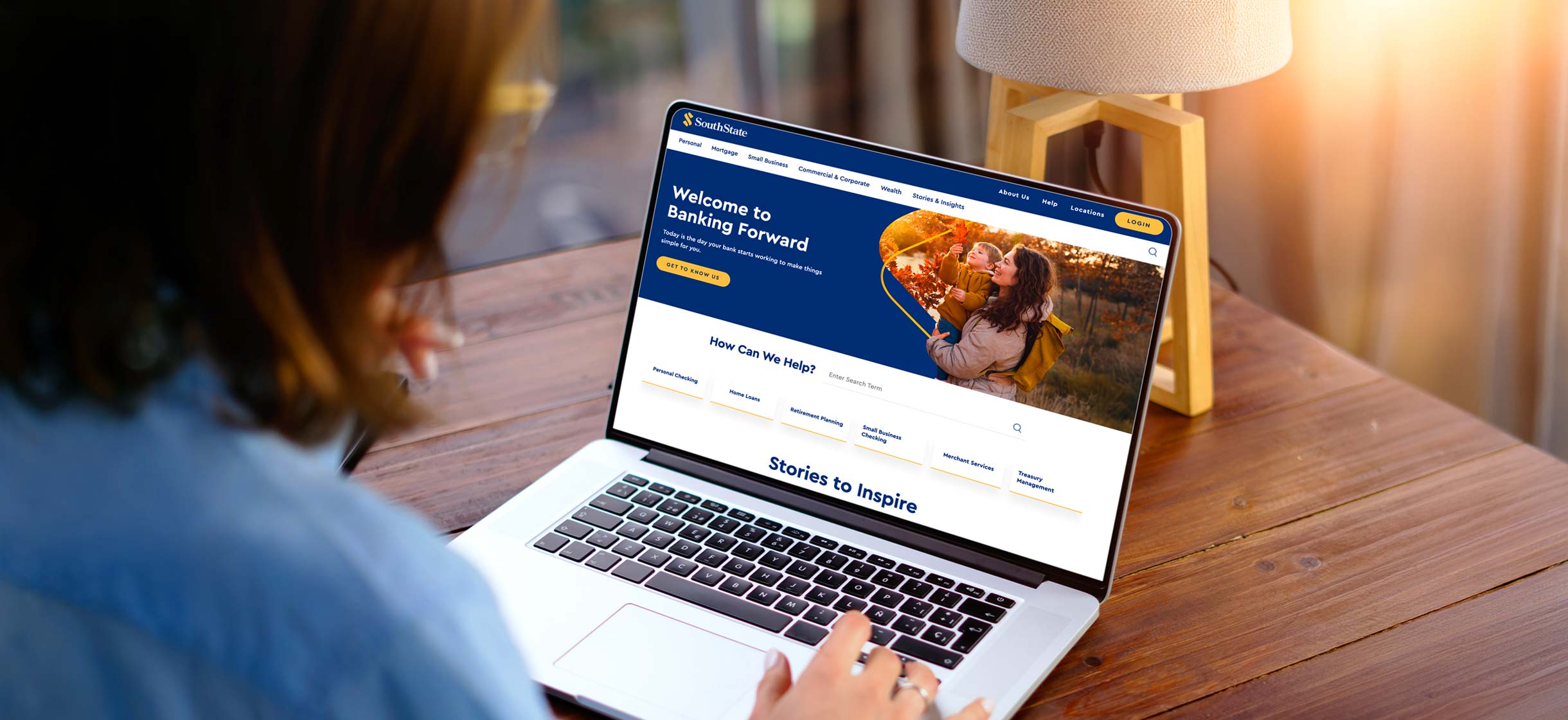 Woman at desk using laptop to view SouthState Bank's New Website