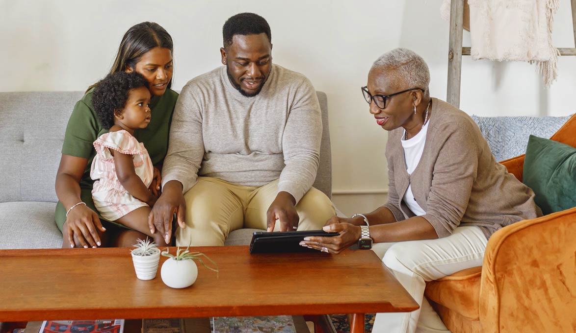 multi-generational family discussing finances in living room