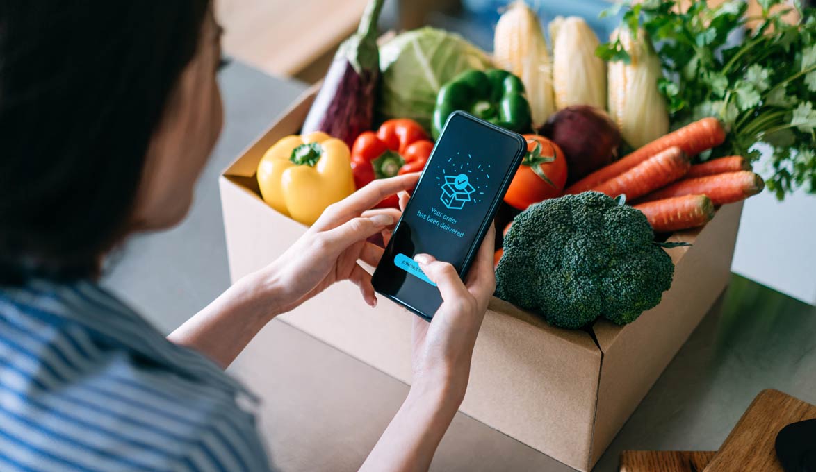 Woman Accepting Grocery Delivery to Home