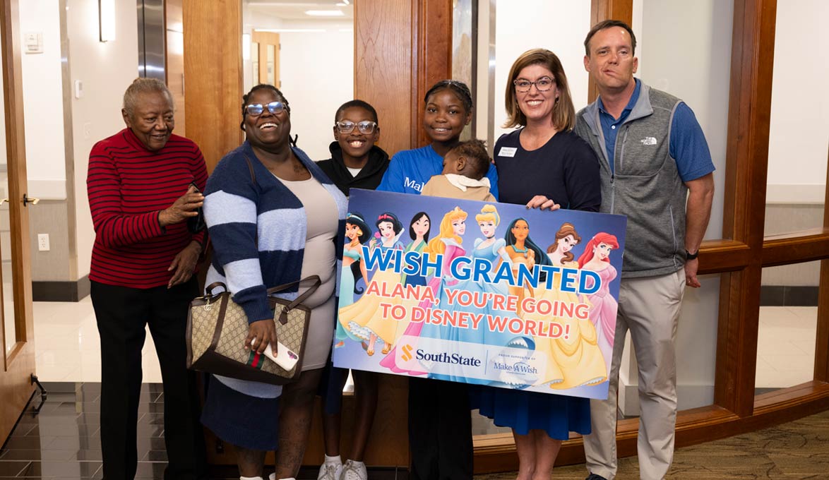 Alana being gifted trip to Disney World with her family members