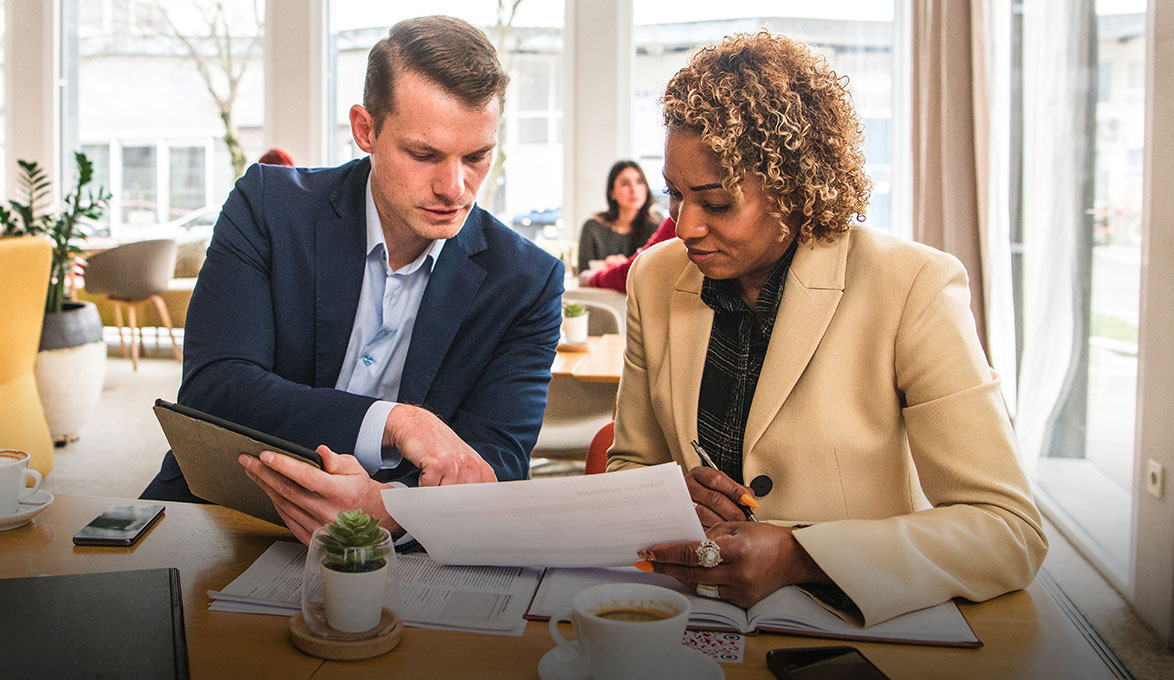 A man and woman work together on investment decisions