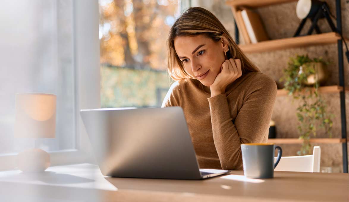 Woman reviewing her business accounts on her laptop