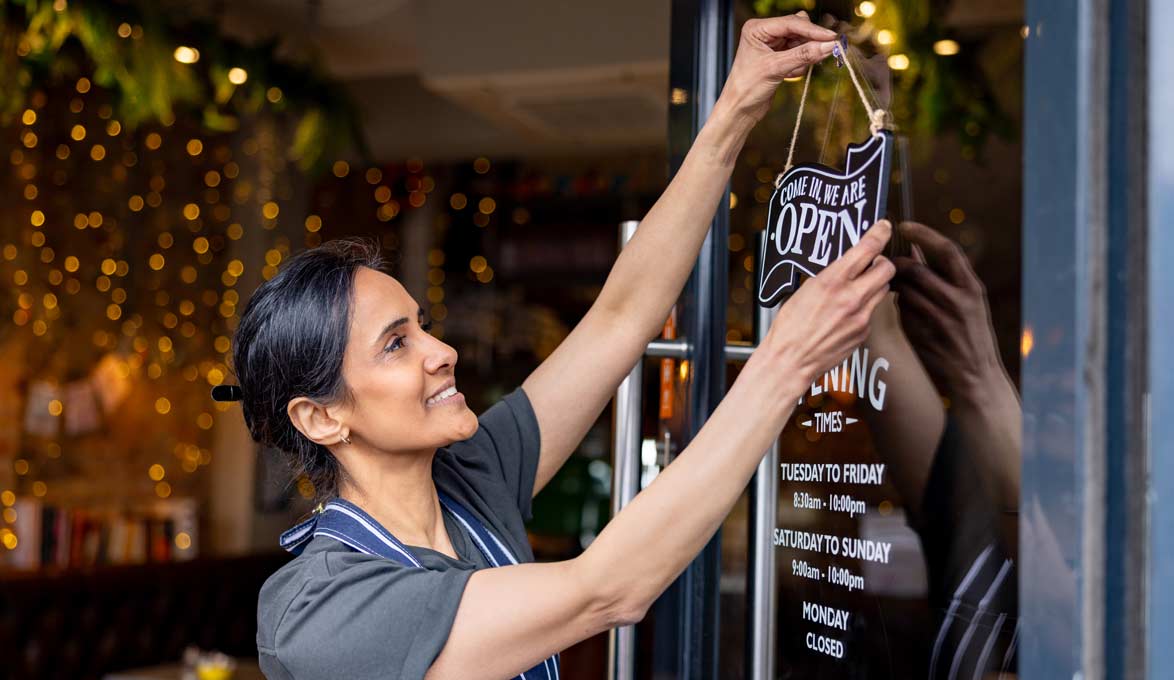 Woman opening her small business for operations