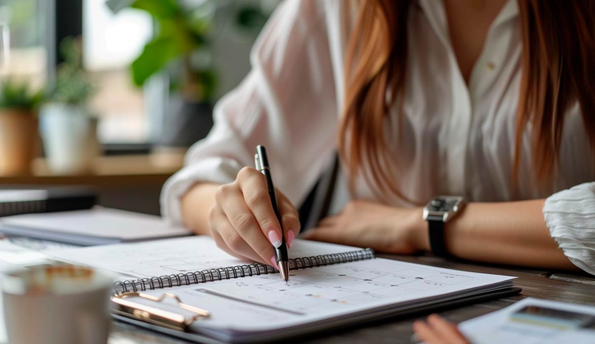 Woman Organizing Dates in Her Calendar