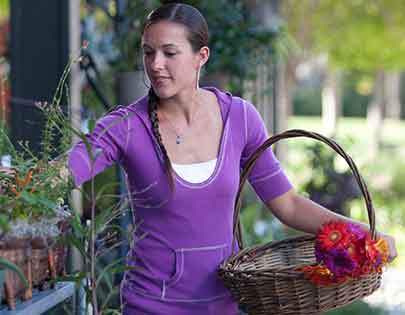 woman growing savings while shopping for flowers