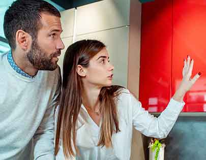 young couple redecorating house with loan