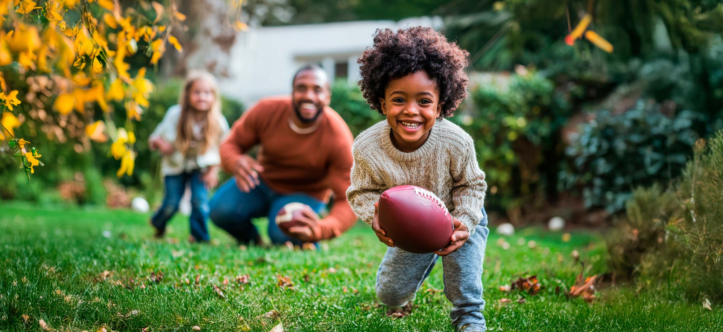 A family plays football in their yard