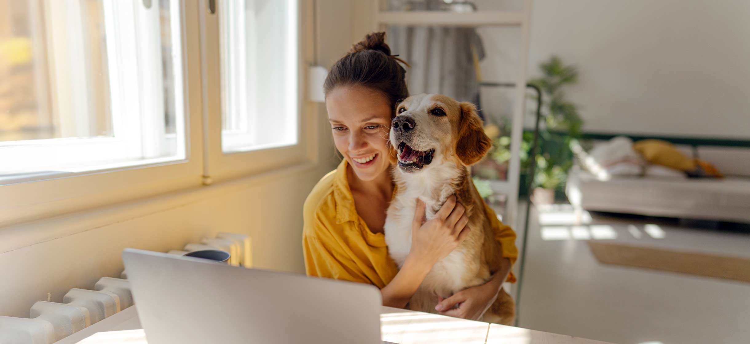 A woman with her dog considering refinancing