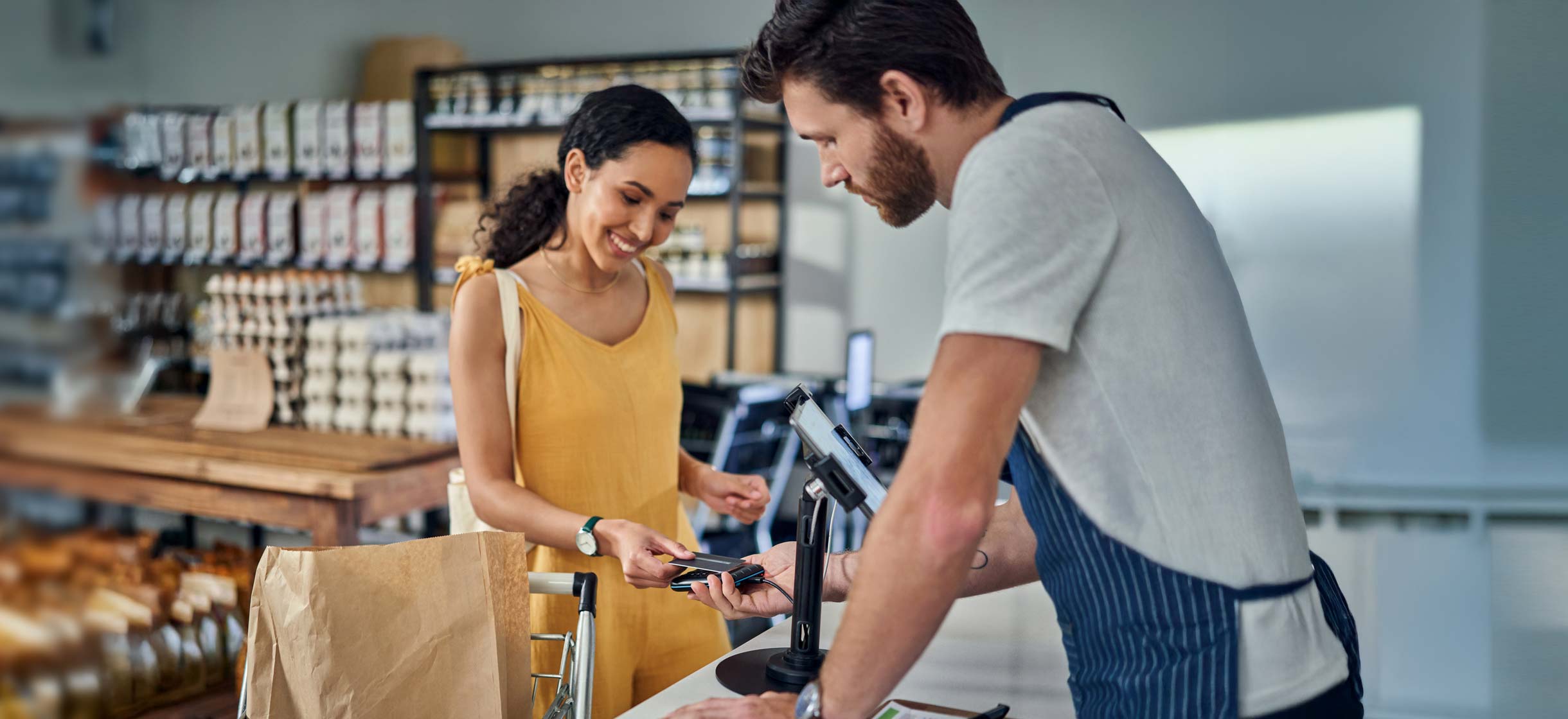 A woman increases her savings with everyday purchases