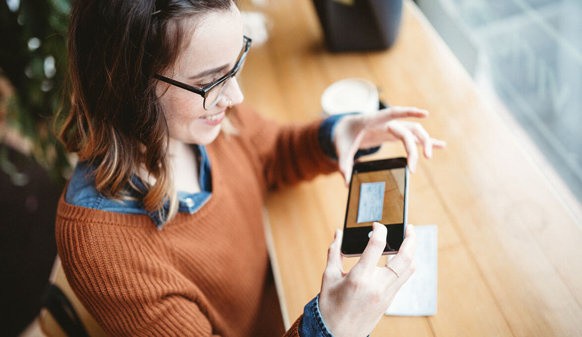 young woman using mobile deposit