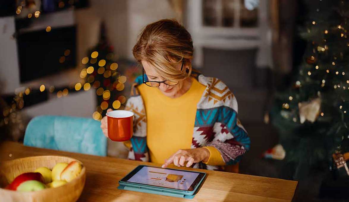 Woman being a savvy holiday shopper from home