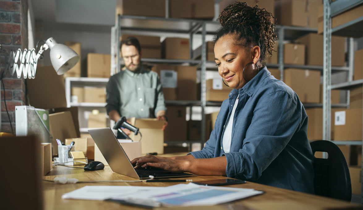small business owner budgeting on laptop