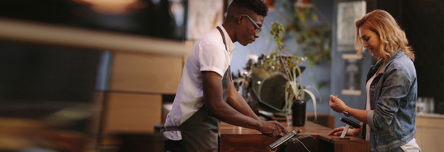 restaurant owner using a merchant service terminal