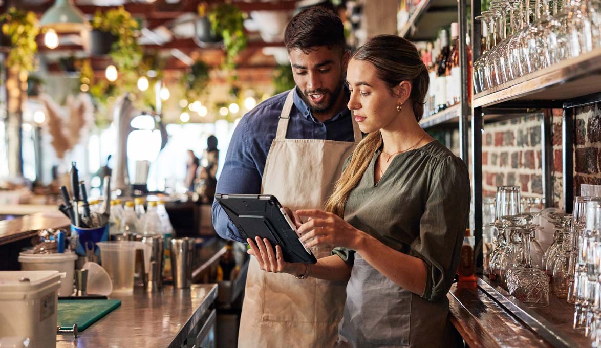 Business owners using a tablet.