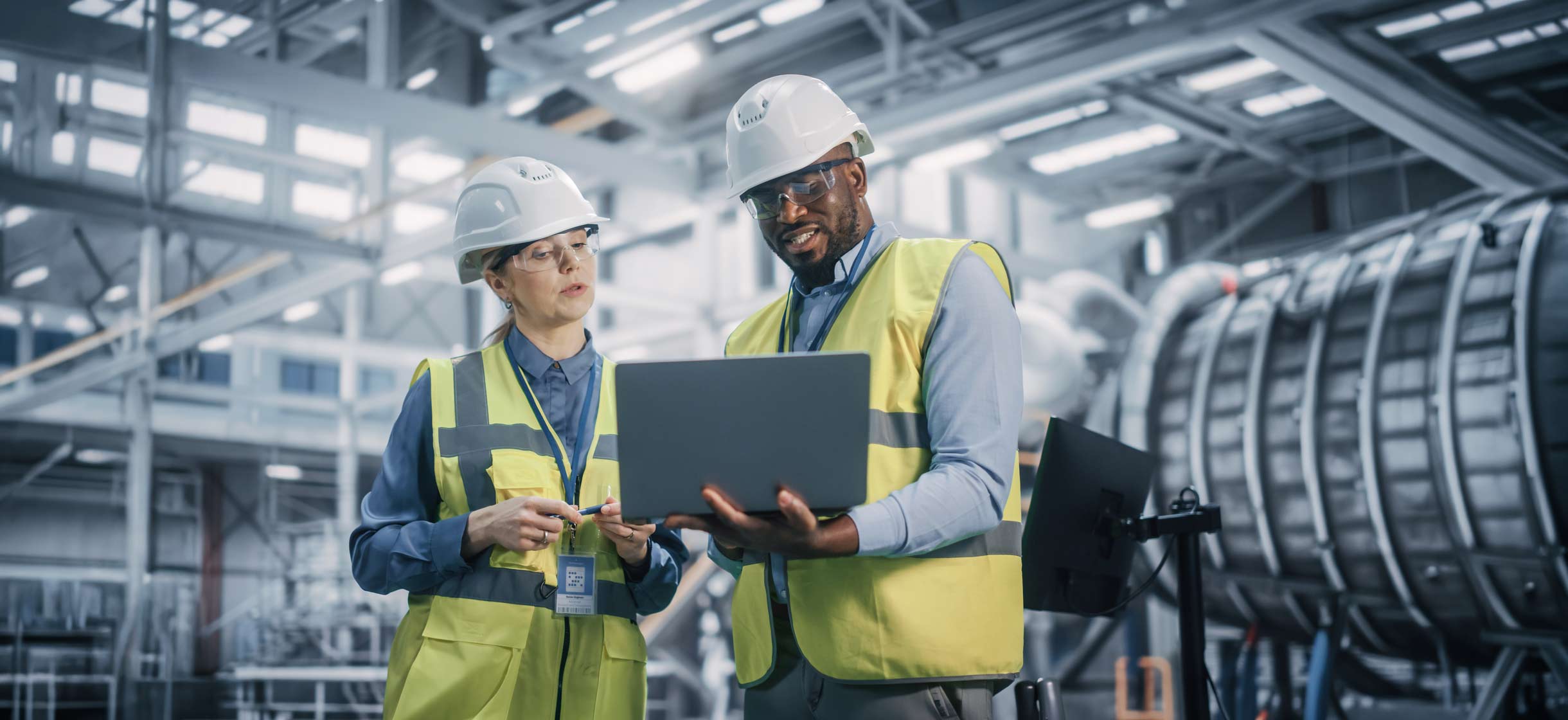 Small business owner in warehouse with employees