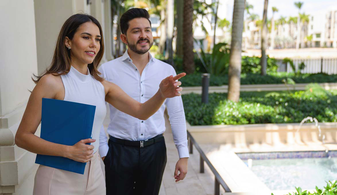 young professional looking at condos with a realor in miami