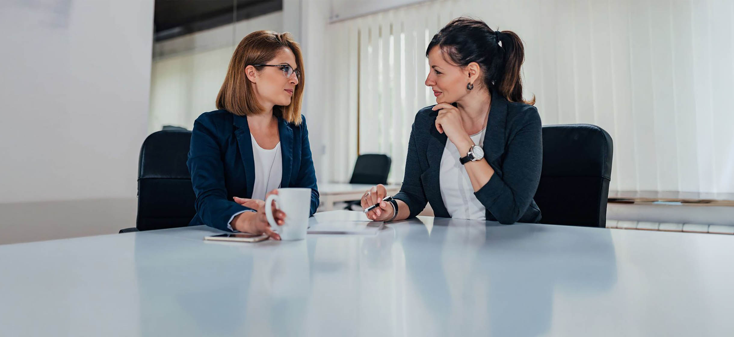 A commercial business owner meeting with a financial advisor
