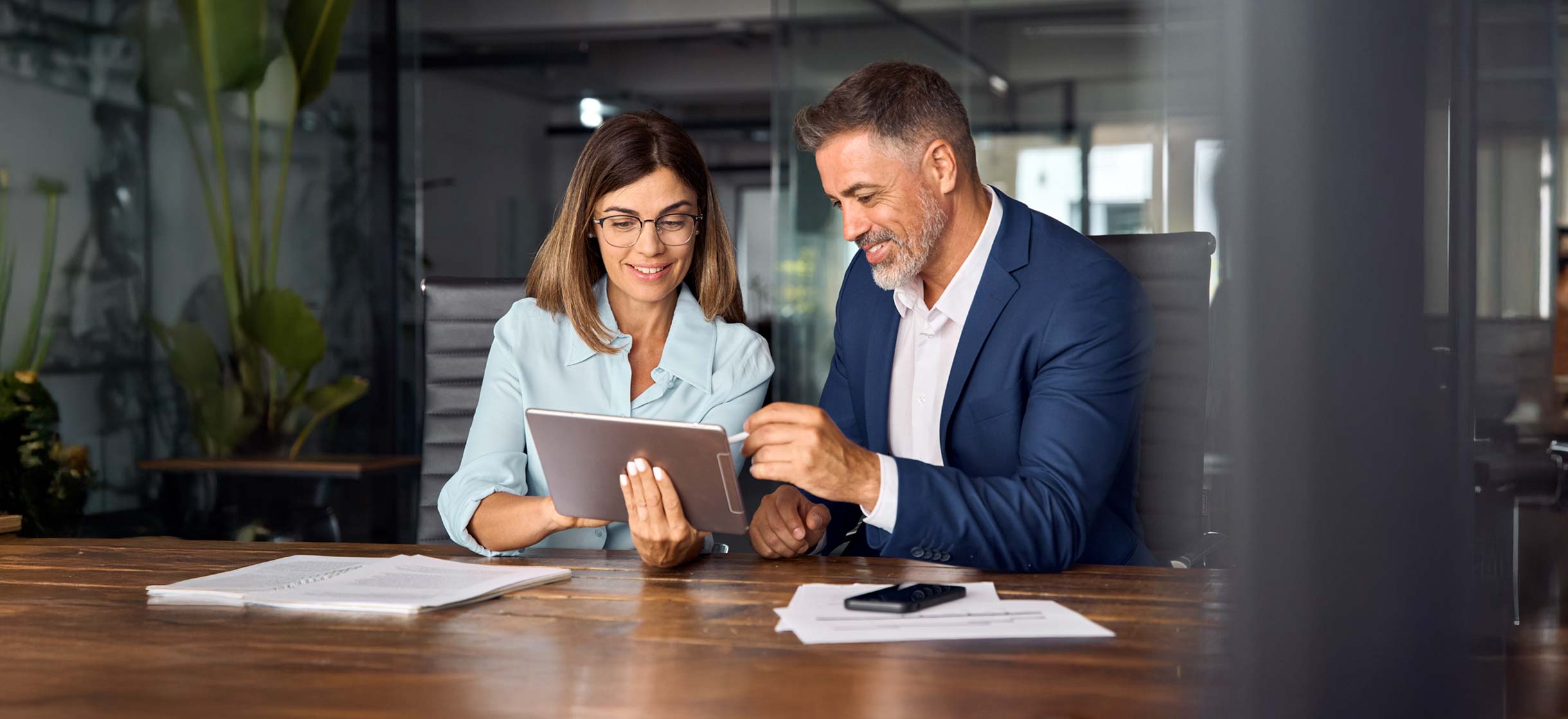 A commercial business owner meeting with a financial advisor