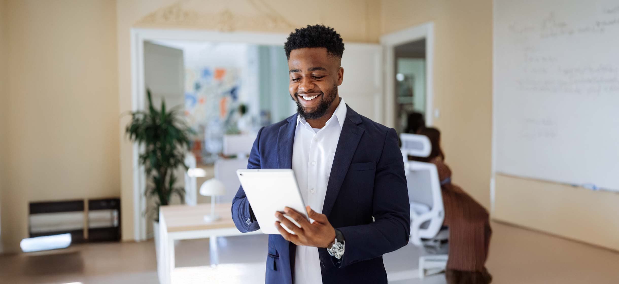 A business owner makes an instant payment from his tablet