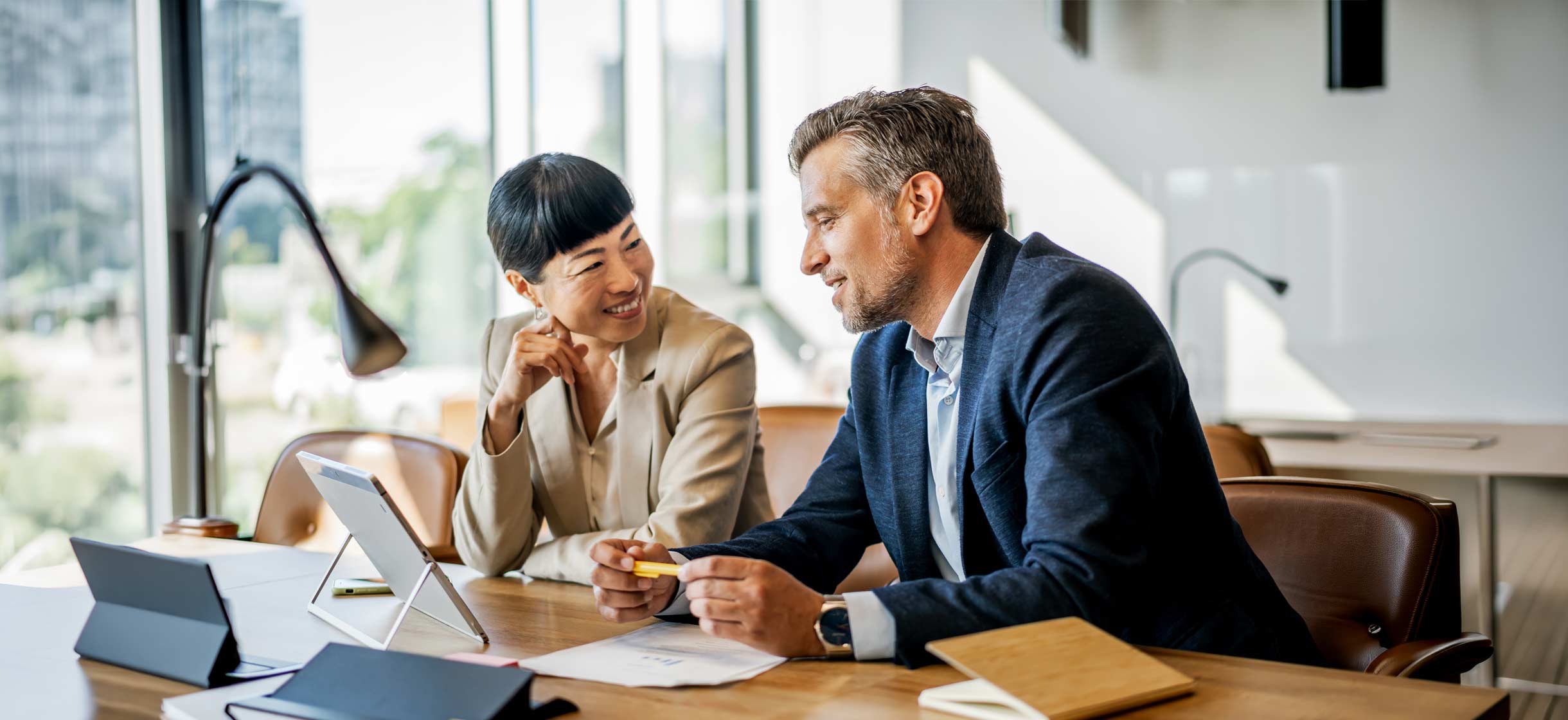 A commercial business owner meeting with a financial advisor
