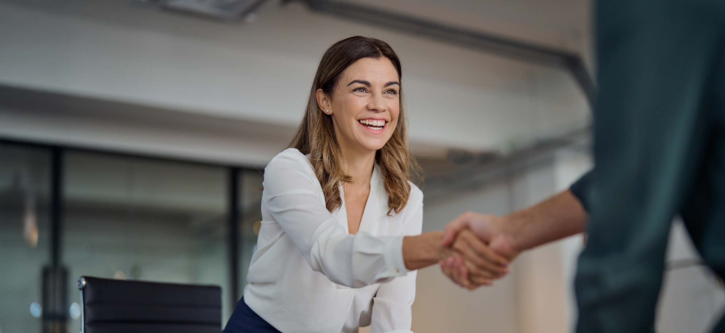 A commercial business owner meeting with a financial advisor