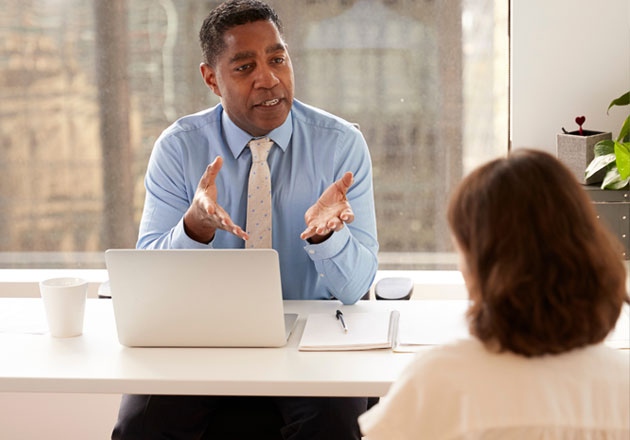 Risk management advisor talking with a client