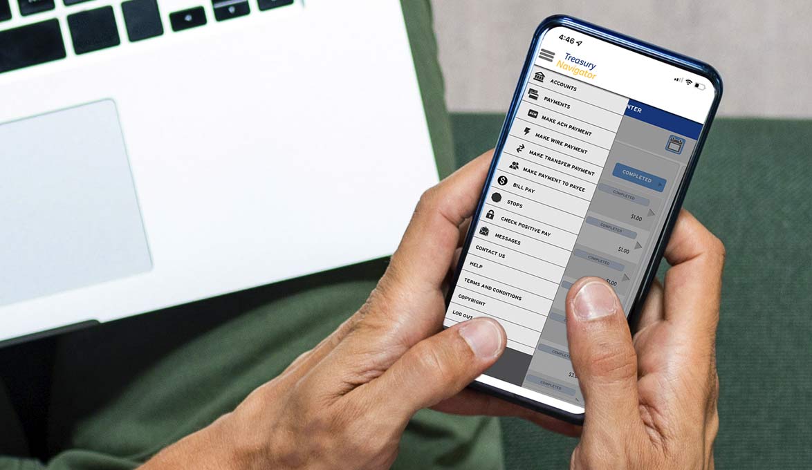 business owner using treasury navigator mobile for convenient business cash management