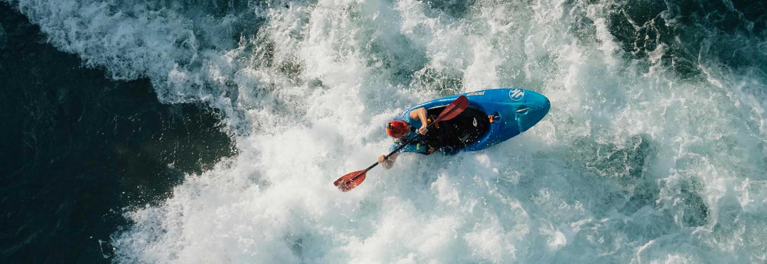 Person kayaking at the U.S. National Whitewater Center, a SouthState client