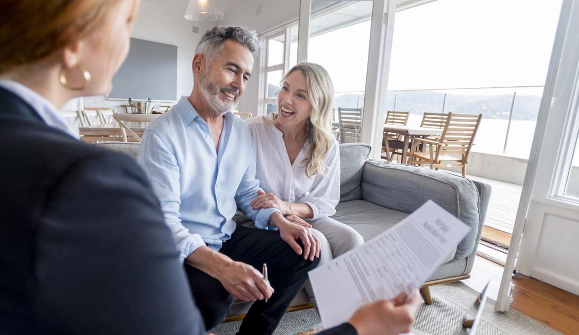 Two SouthState clients talking to a financial planner.
