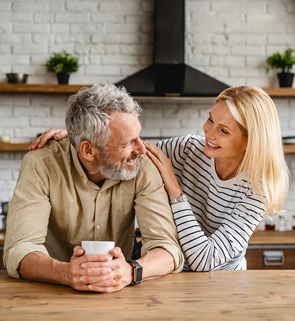 A mature couple in a kitchen
