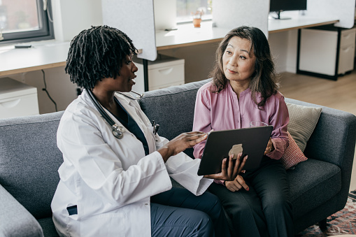 Women doctor talking to patient.