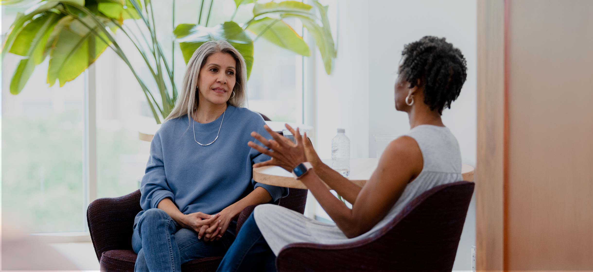 Two women discussing finances