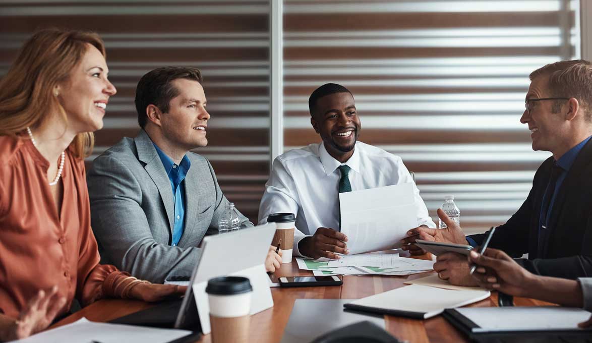employees at work discussing 401k options and when to retire