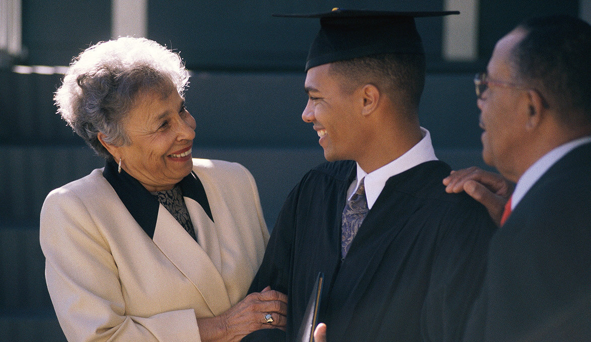 proud parents with college graduate son