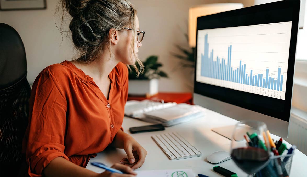 young professional woman reviewing stock portfolio performance in downturn