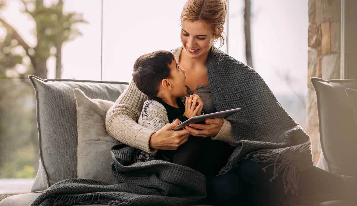 mother with her young son learning about investing in a 529 for college education