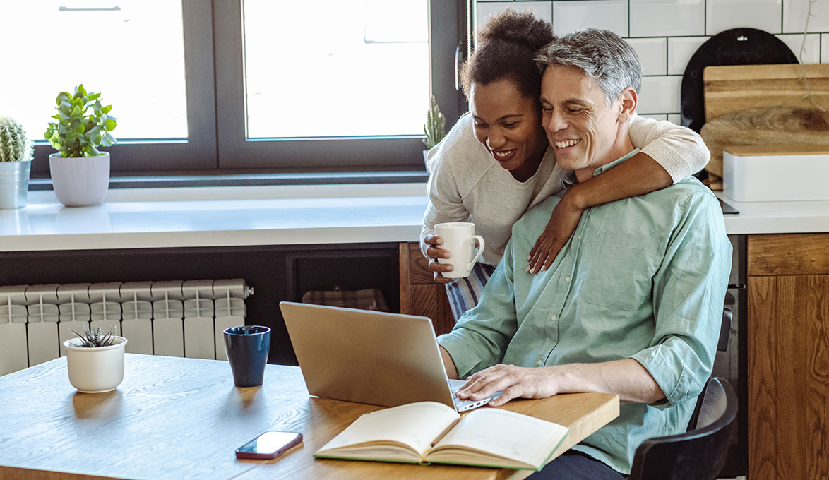 Couple using laptop.