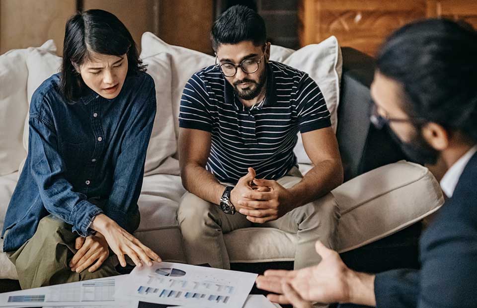 couple meeting with financial advisor for an annual review