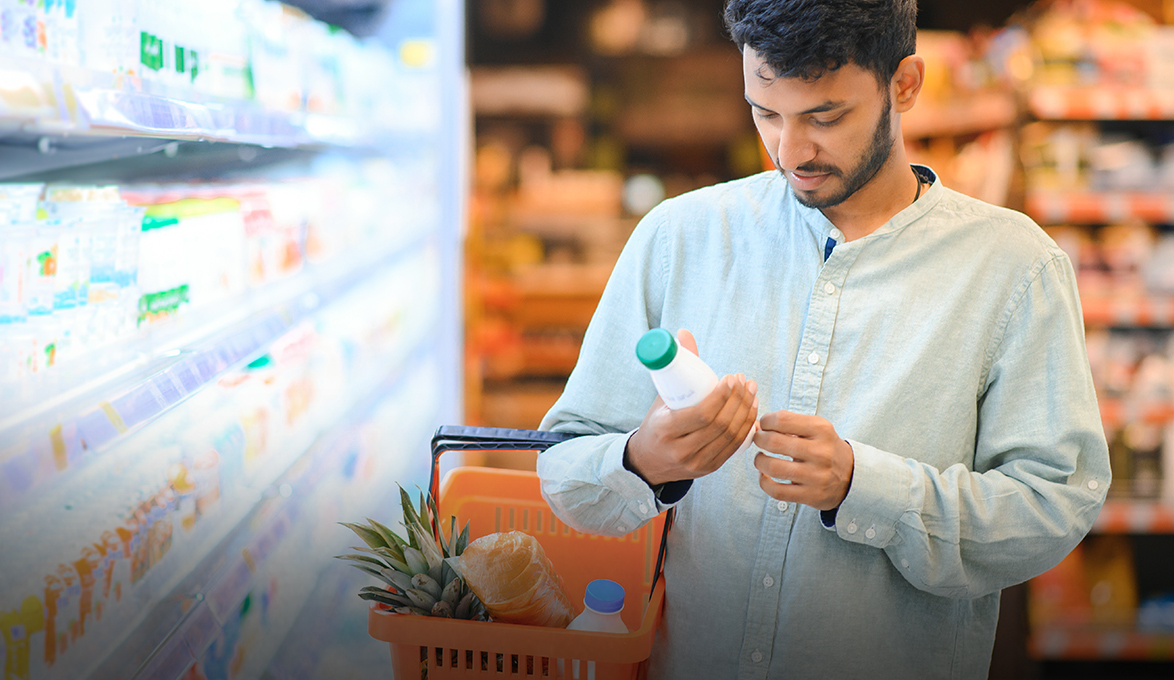 Man considering the cost of groceries within his budget