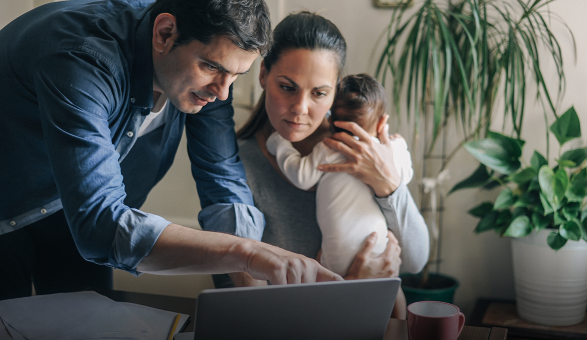 A family looks at their finances to determine life insurance needs