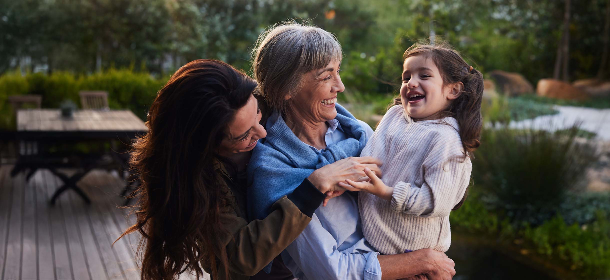 A multigenerational family hugging