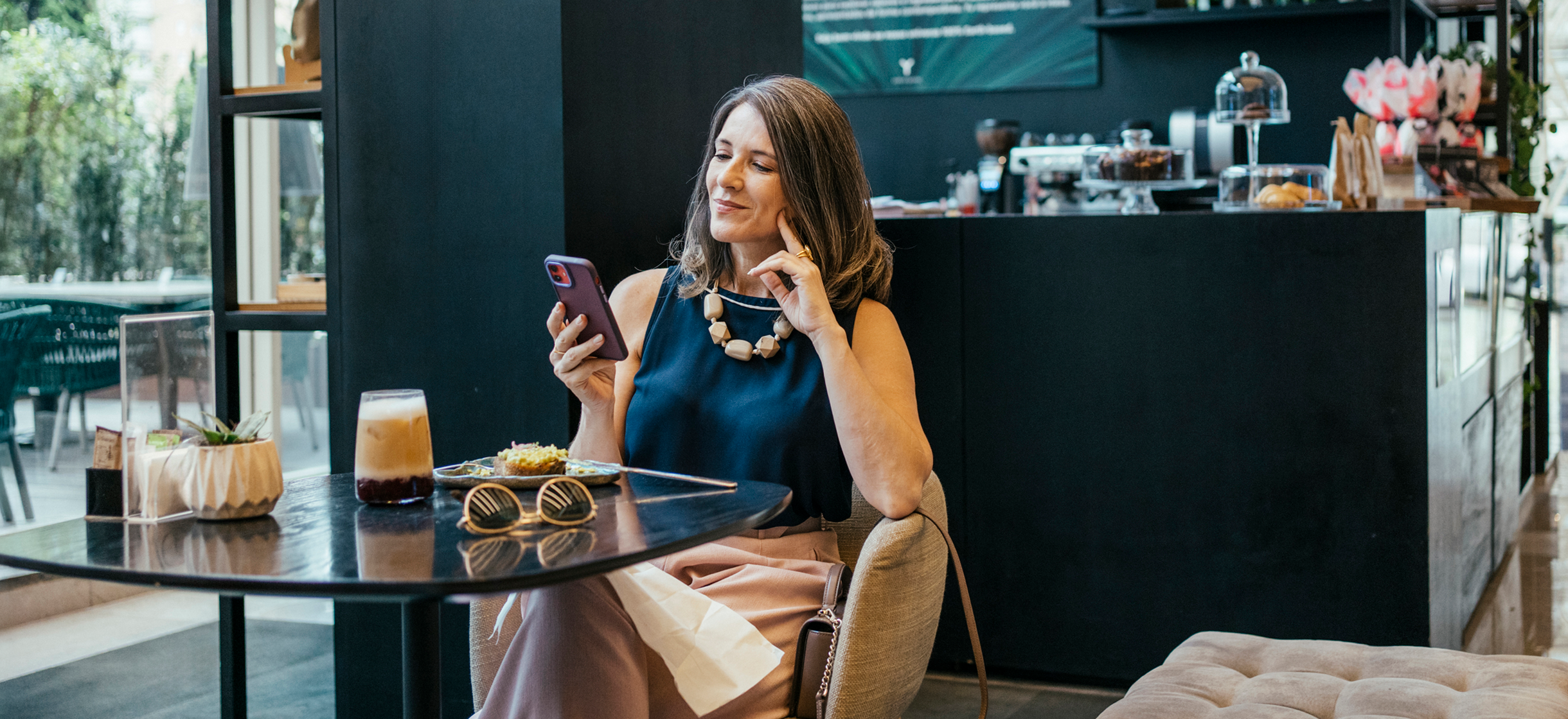 A woman stays up to date on latest market news
