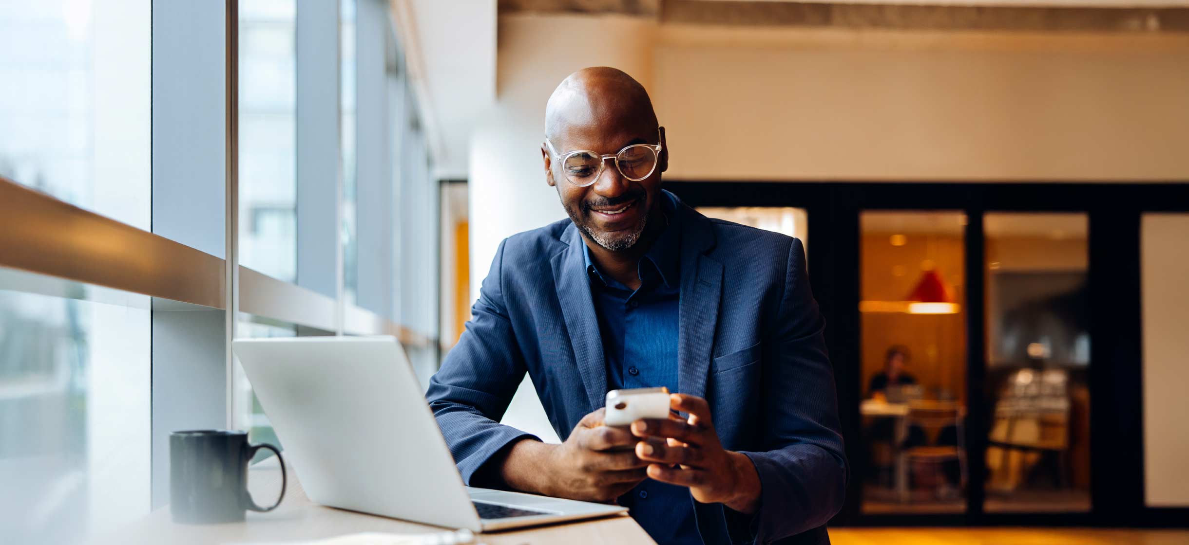 A man stays up to date on latest market news