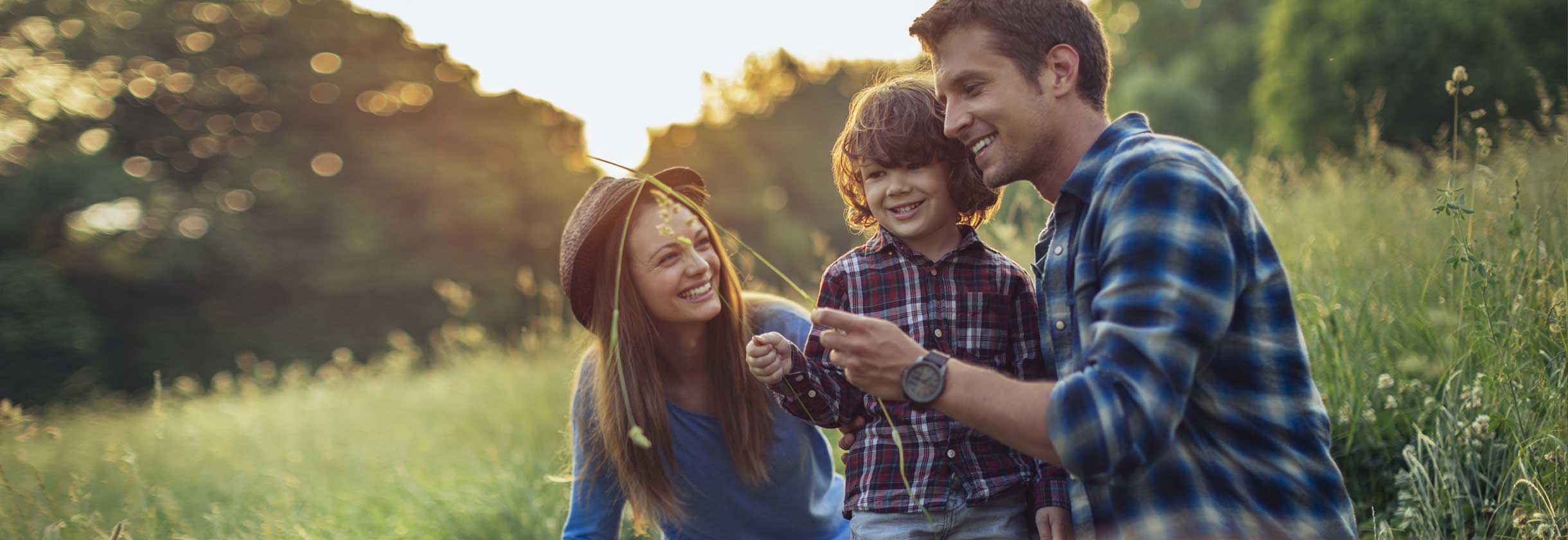 Family playing in the grass