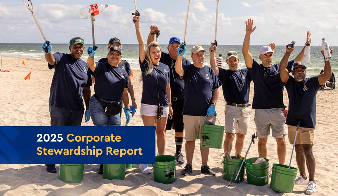 SouthState team members cleaning up a local beach