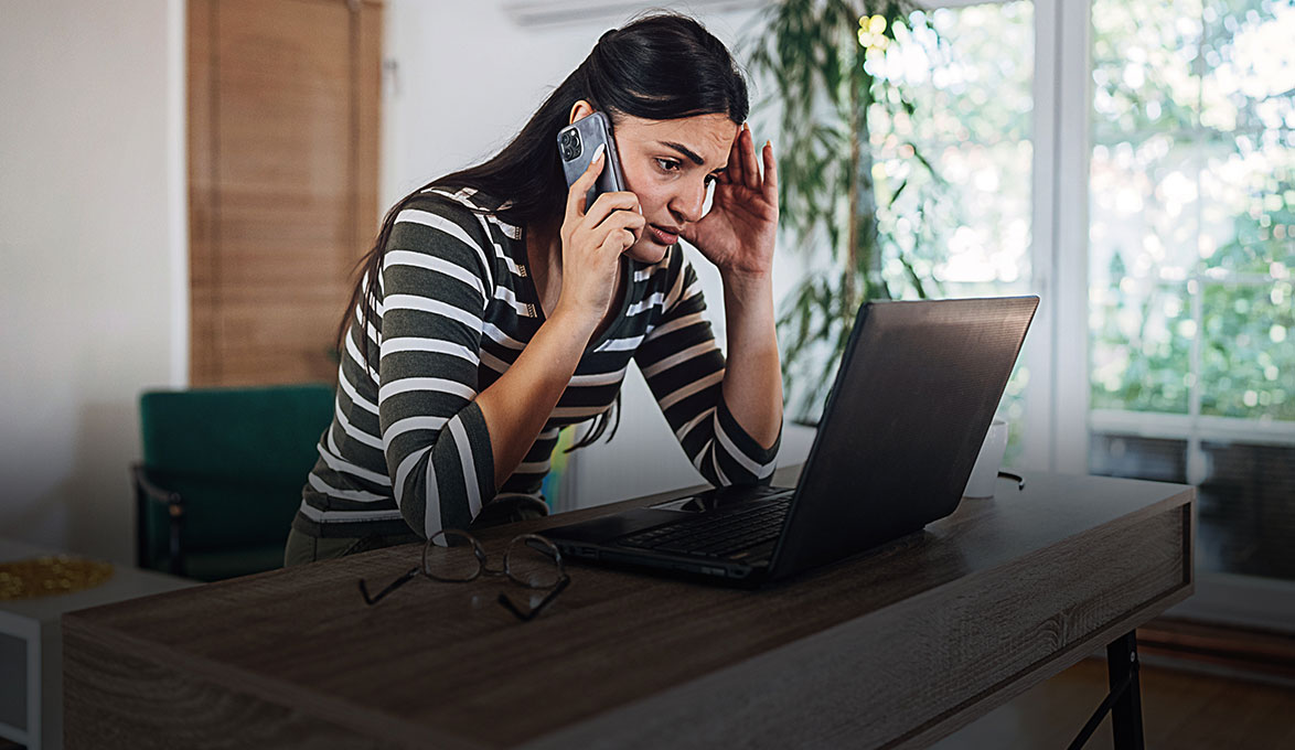 Victim of bank fruad talking on the phone