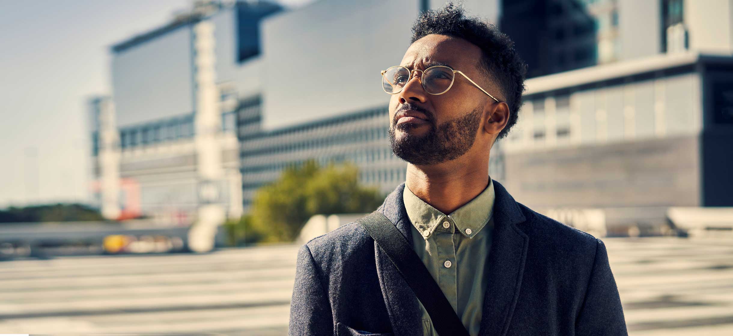 young professional outside a downtown office