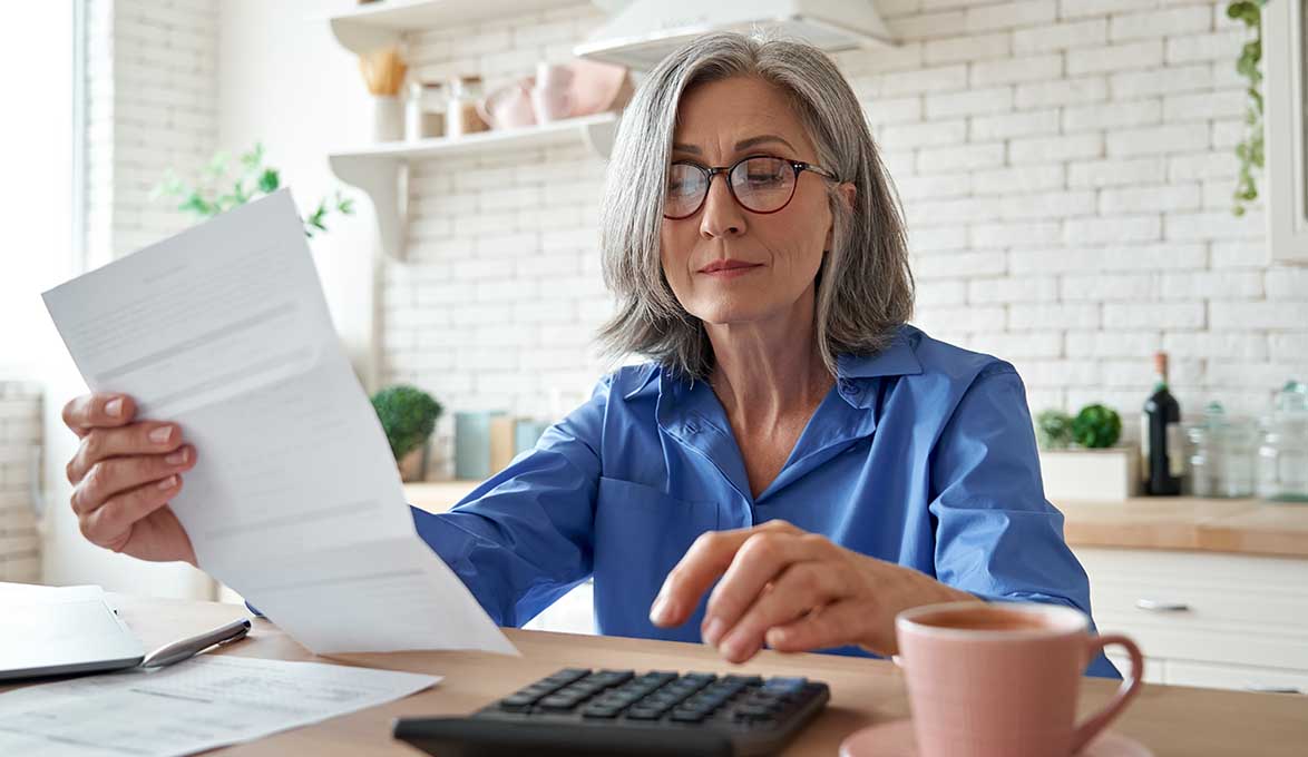 business owner calculating debts assets for sba loan